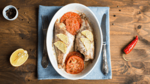 ricetta estiva veloce branzino al forno con pomodori
